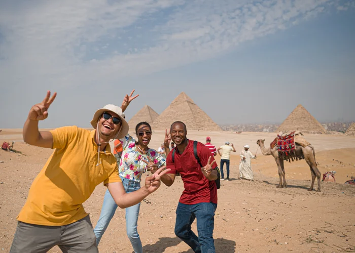 A group photo in front of the pyramids